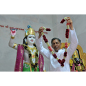 Deepakbhai placing a garland of flowers on Shri Krishna Bhagwan